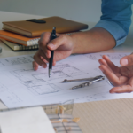 An interior designer reviewing an architectural plan