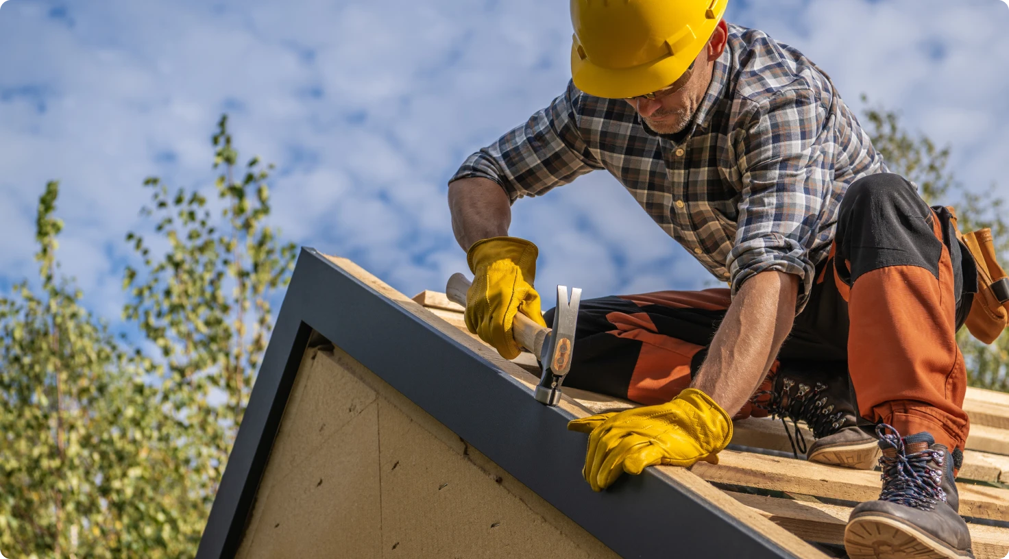 roofer working on house roof