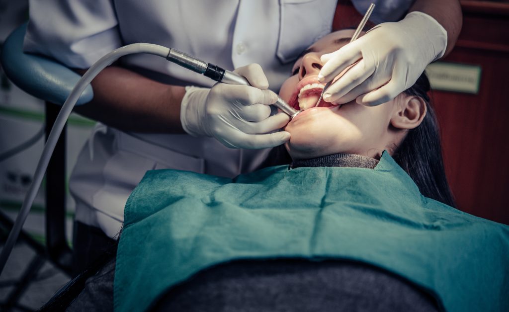 6 Tips For A Smooth Recovery After Oral Surgery 2 dentists treat patients teeth 1024x628 1